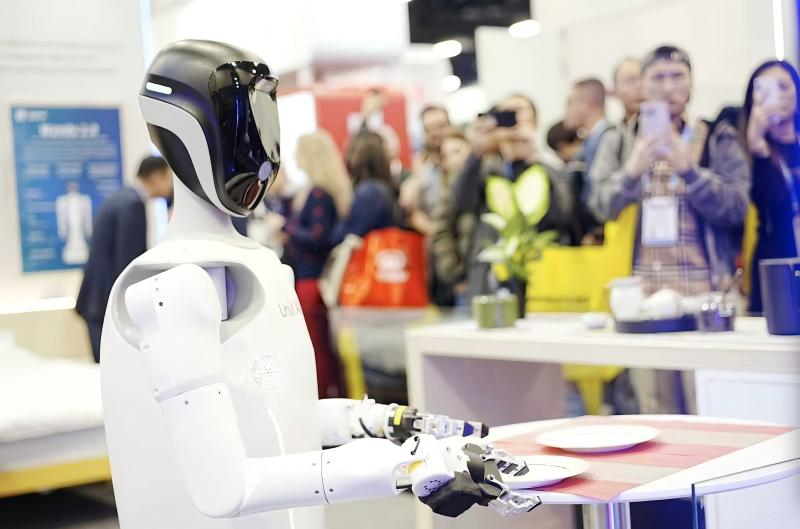 At a global tech expo, UniX AI's Wanda humanoid robot demonstrates precise manipulation, drawing a crowd of onlookers.