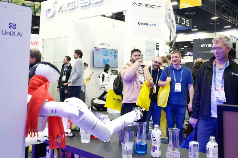 At the global tech expo, AGIBOT's OmniHand robotic hand demonstrates precise manipulation, with spectators watching