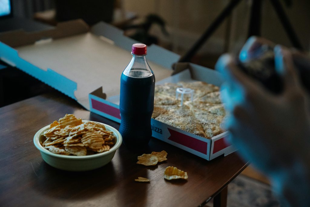 Teen drinking soda with emotional stress concept - sugary drinks and mental health