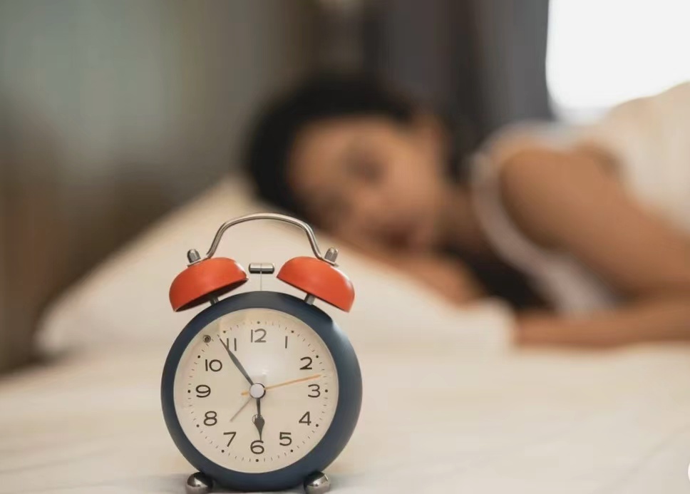 The alarm shows 6:10 AM, reflecting the importance of a regular routine in TCM wellness