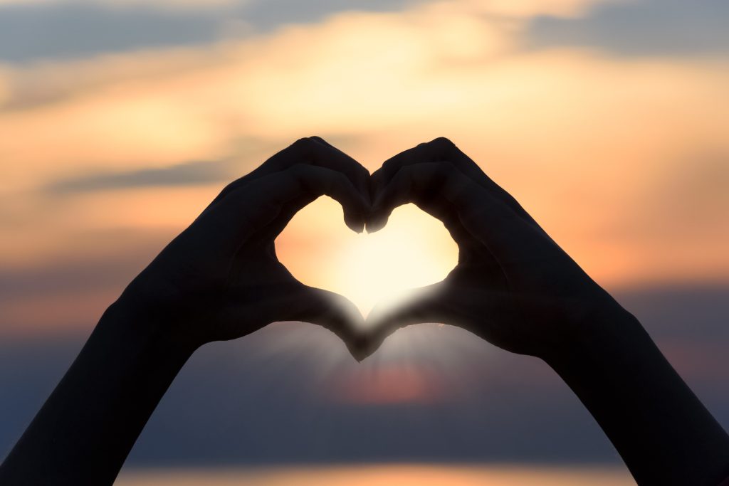 Hands forming a heart, symbolizing self-love and inner compassion