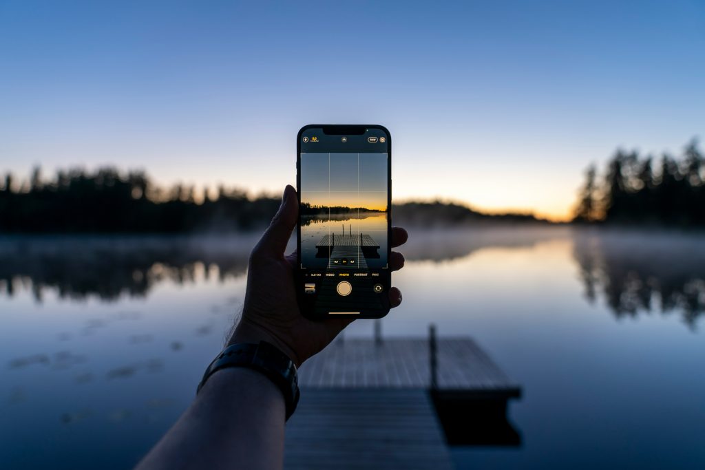 iPhone camera capturing text and objects with Live Text feature, allowing instant copy, translation, and smart image recognition on iOS
