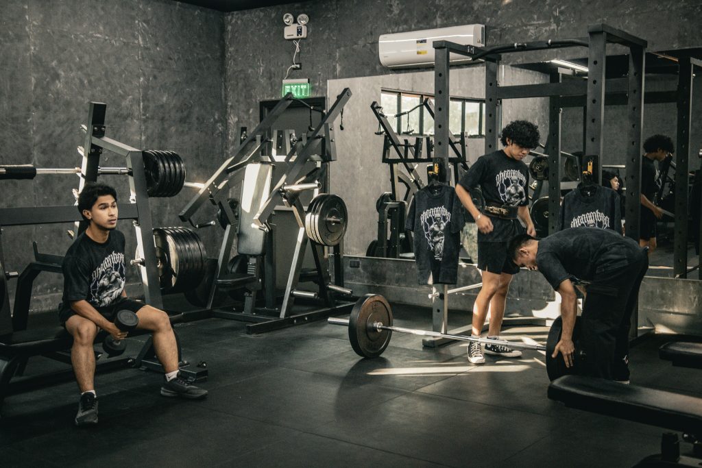 People doing strength training and different workout exercises in gym