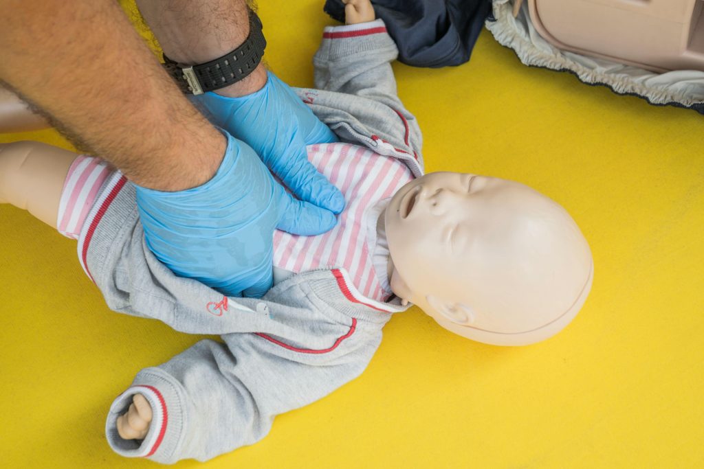 Infant choking first aid back blows and chest thrusts