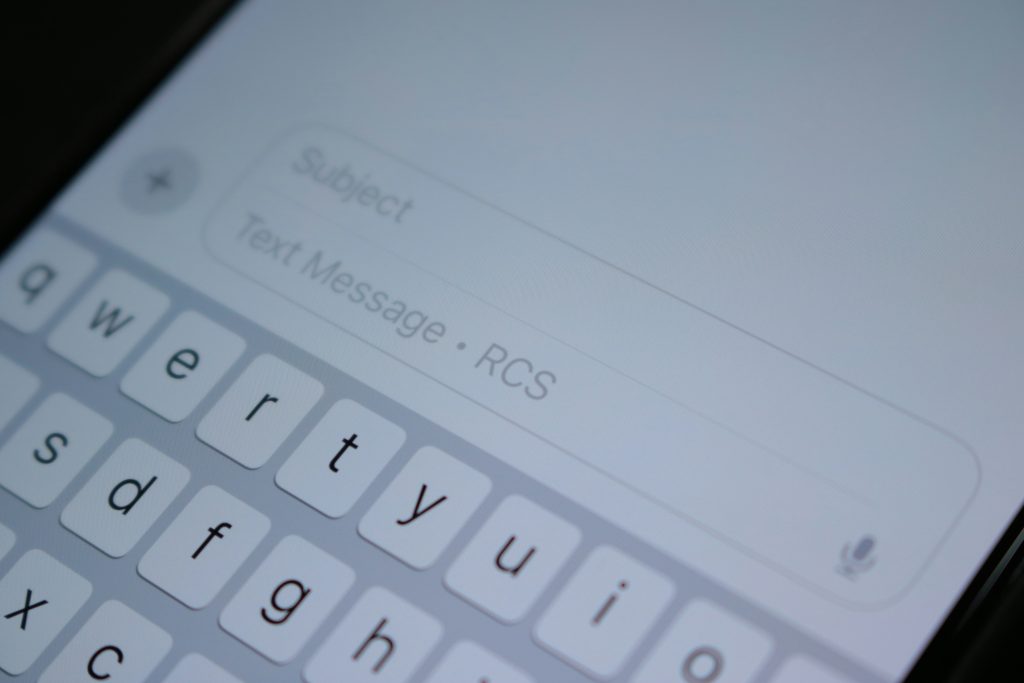 Smartphone keyboard typing with cursor control and text editing features, showing advanced iPhone hidden typing shortcuts and productivity tools