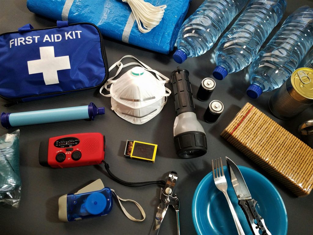 Emergency survival kit with water flashlight food supplies typhoon
