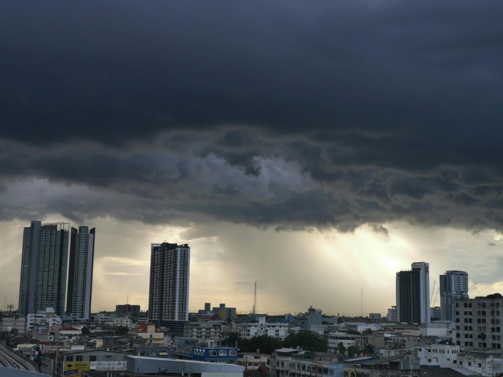 Typhoon storm clouds over city skyline